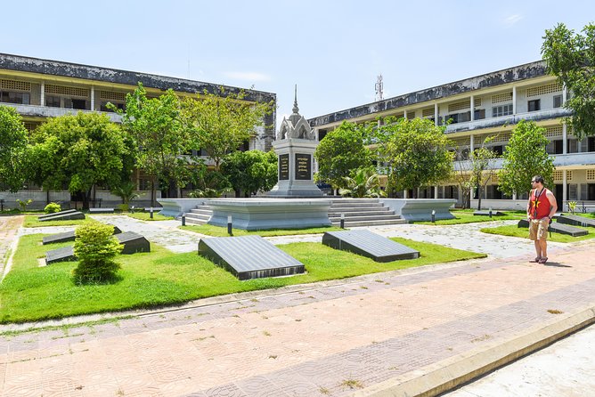 Remnants of a Khmer Rouge Era - Choeung Ek Killing Fields: the memorial stupa and the excavations
